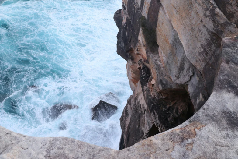 a view of a couple of cliffs, and the ocean from above