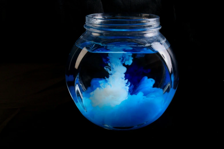 the blue liquid in the glass jar is blue