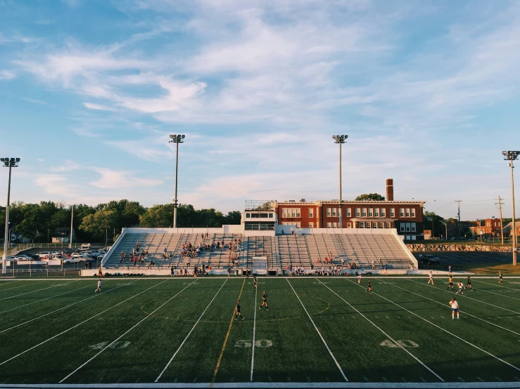 the field at a football stadium where players are playing