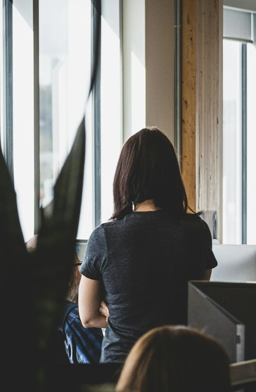 an image of a woman sitting and holding another person