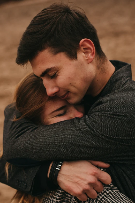 man emcing his girlfriend in the middle of a hug