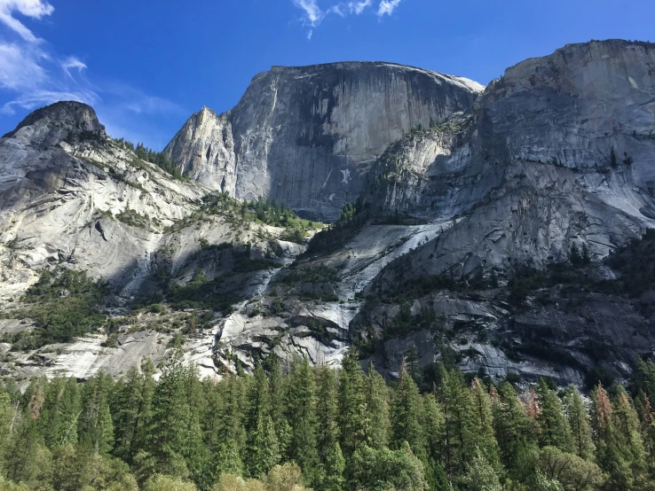 mountains in the background with trees near by