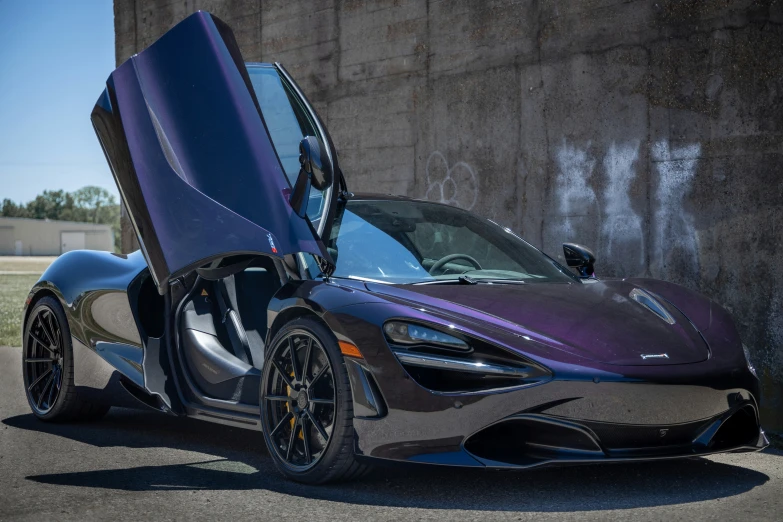 a sports car with its open doors on display