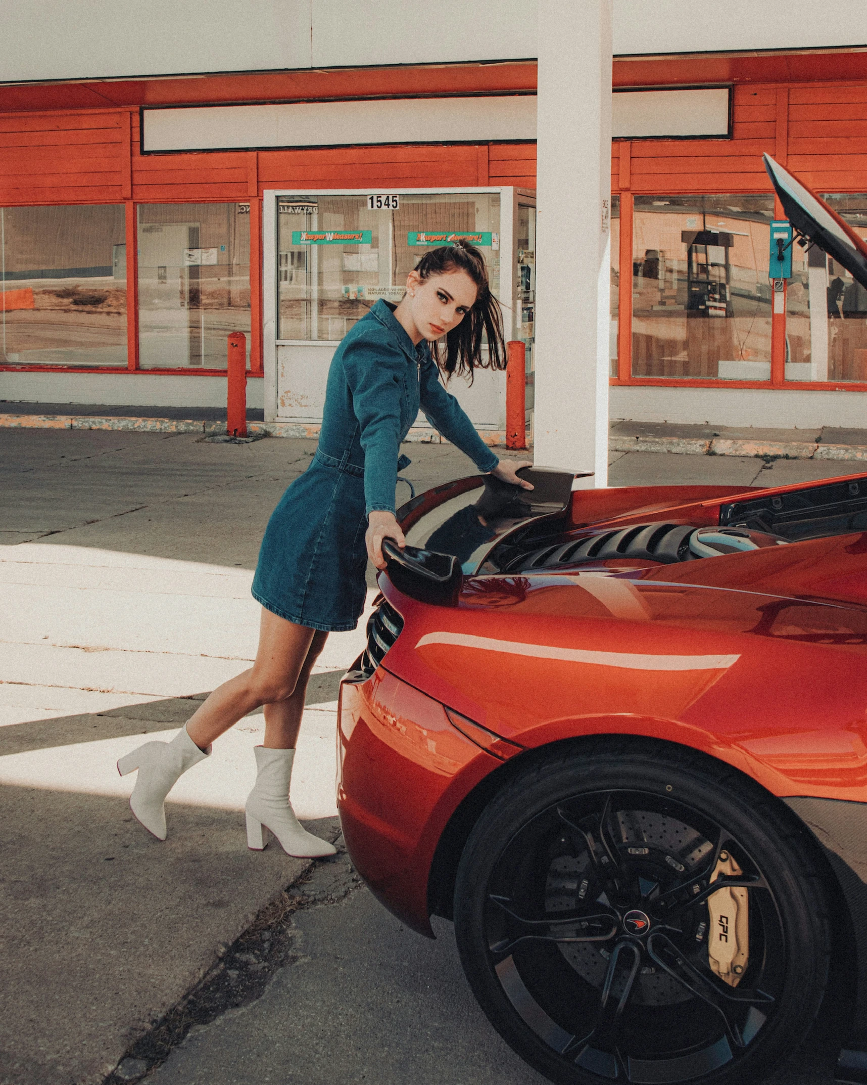 a woman is loading her car with her trunk