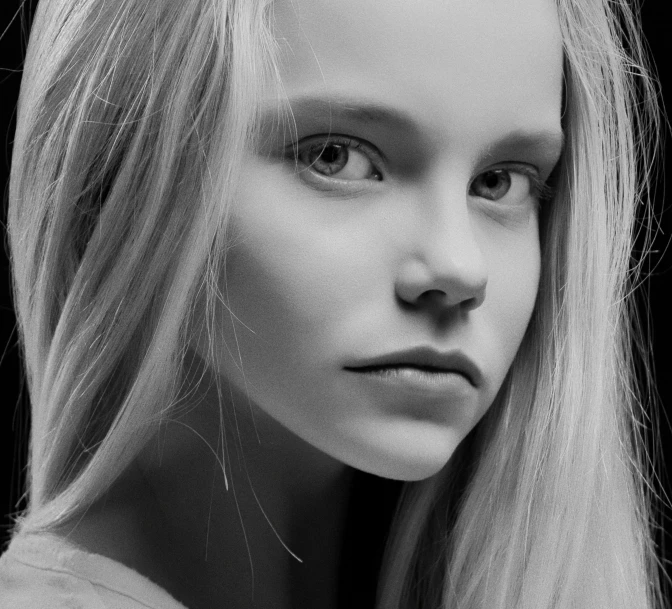 a black and white po of a model with blond hair