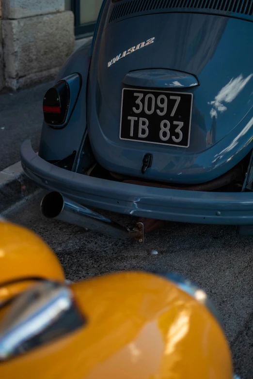 an old model car on display in front of a building