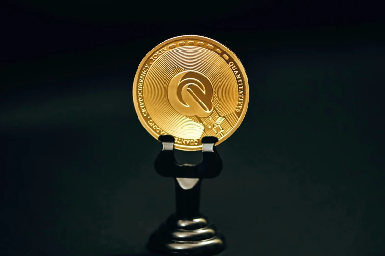 a shiny and shiny bitcoin stand against a black background