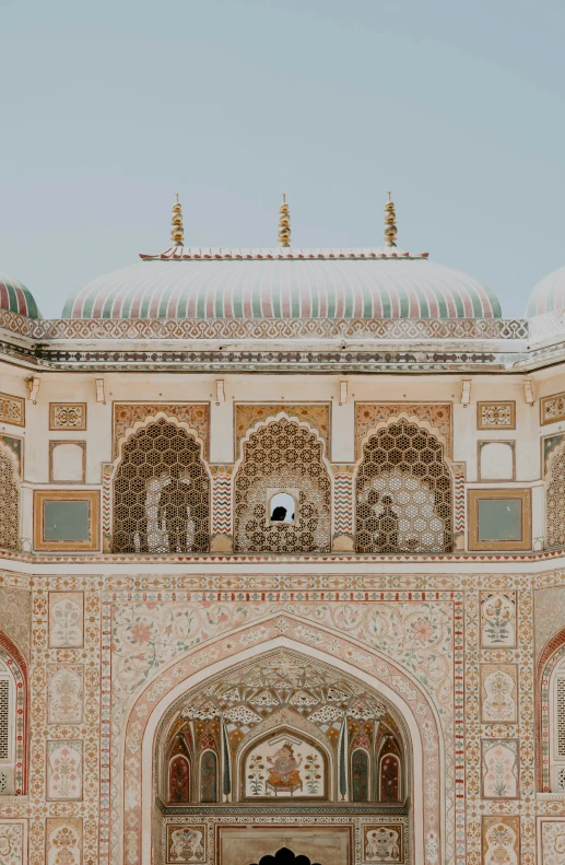 an open building with ornate arches and columns