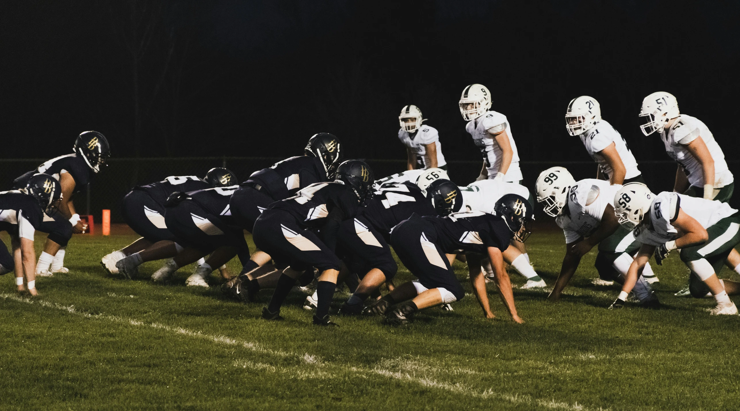 a football team plays against each other on a soccer field