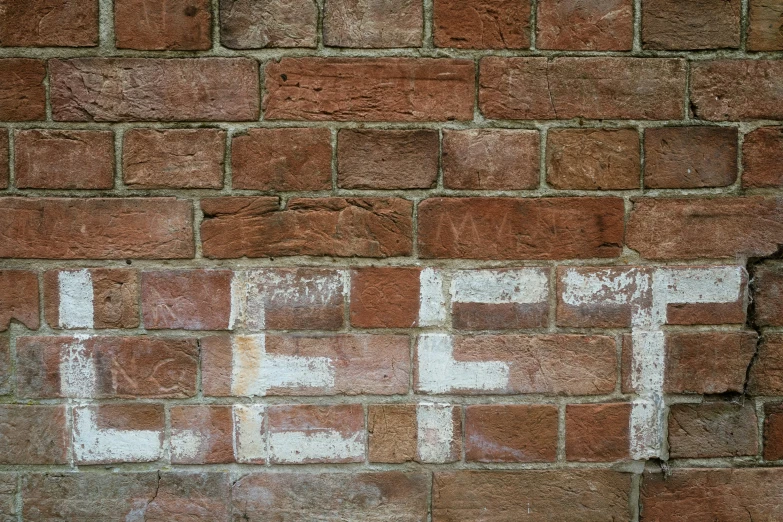 a street sign attached to a brick wall