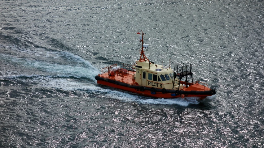 a small boat on the water with a flag