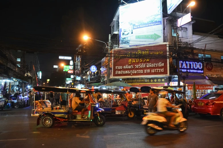 a busy city street filled with lots of people