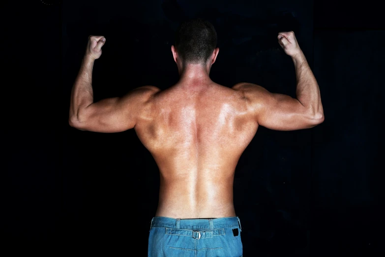 man's back with his arms behind him and upper body