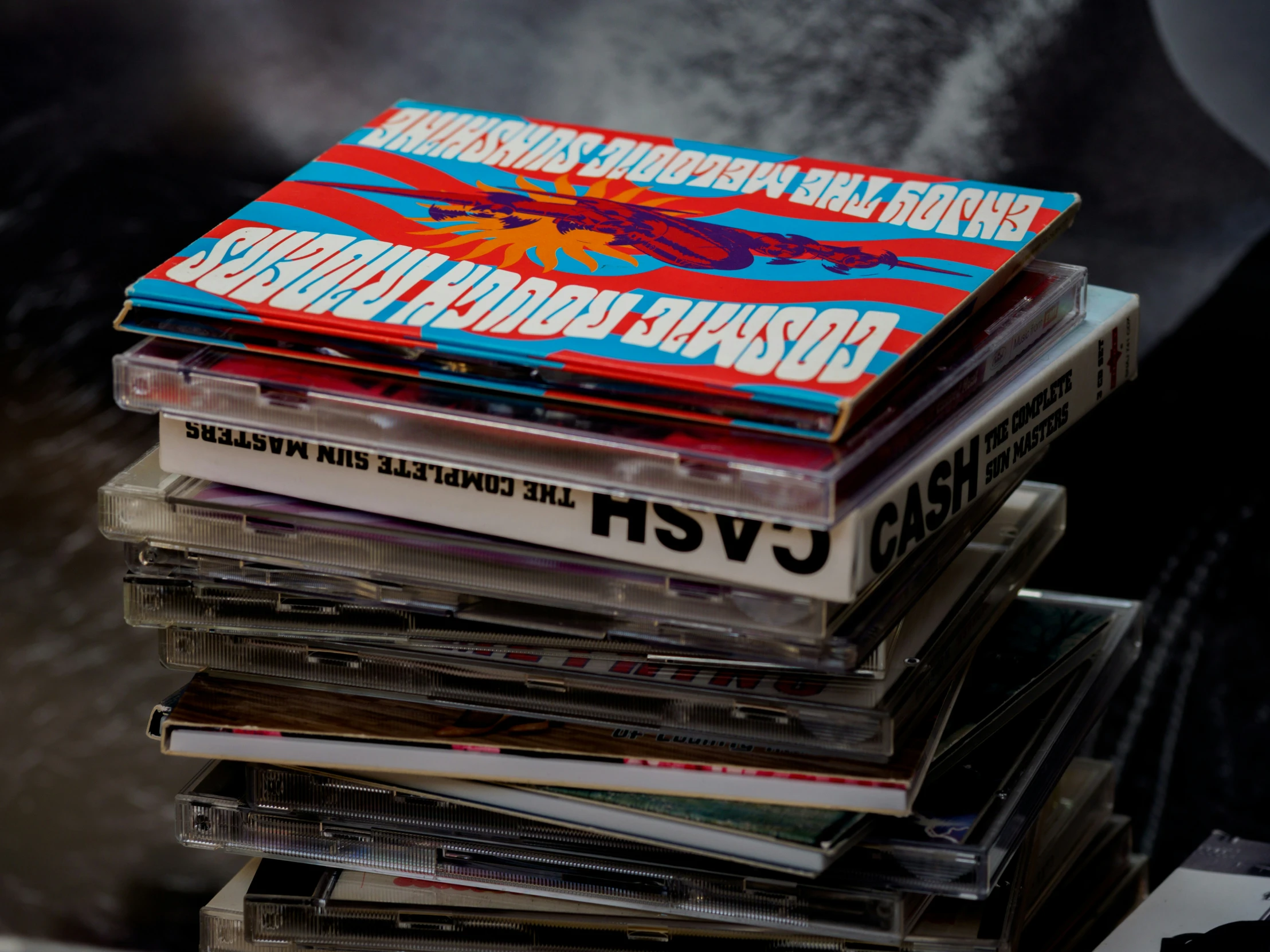 stacks of vinyl records are stacked up