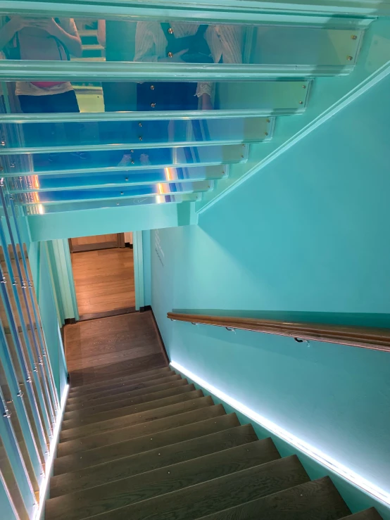 staircase with wood steps and clear blue paint