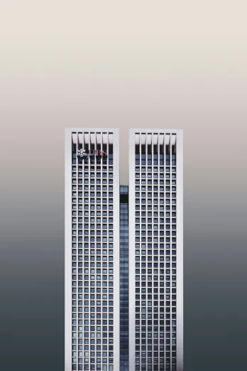 two very tall white buildings standing side by side