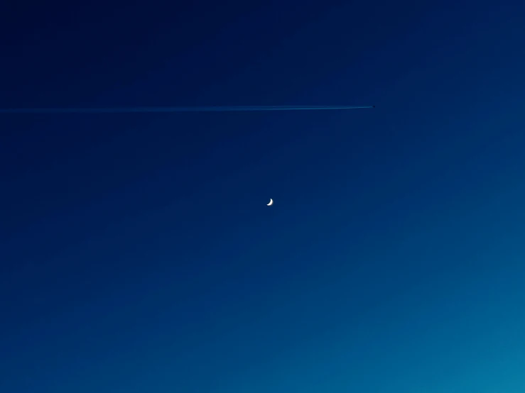 an airplane flying in the sky and passing by