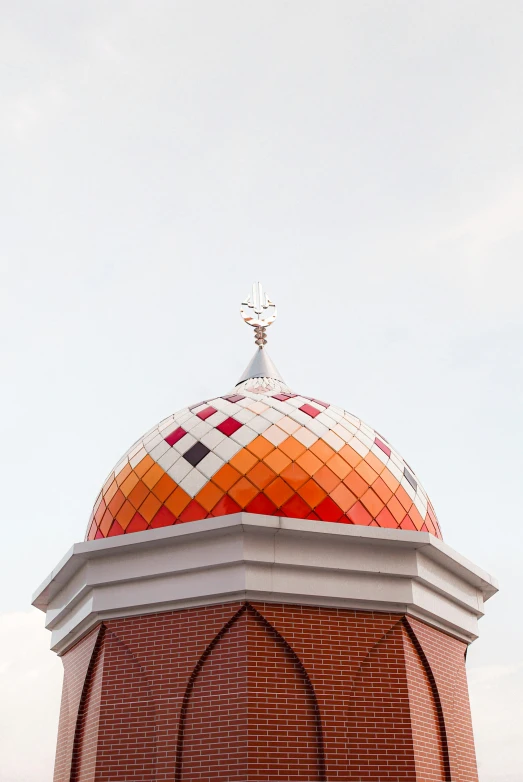 a large building with a round white top and a clock