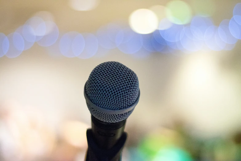 a microphone is shown against a blurred background