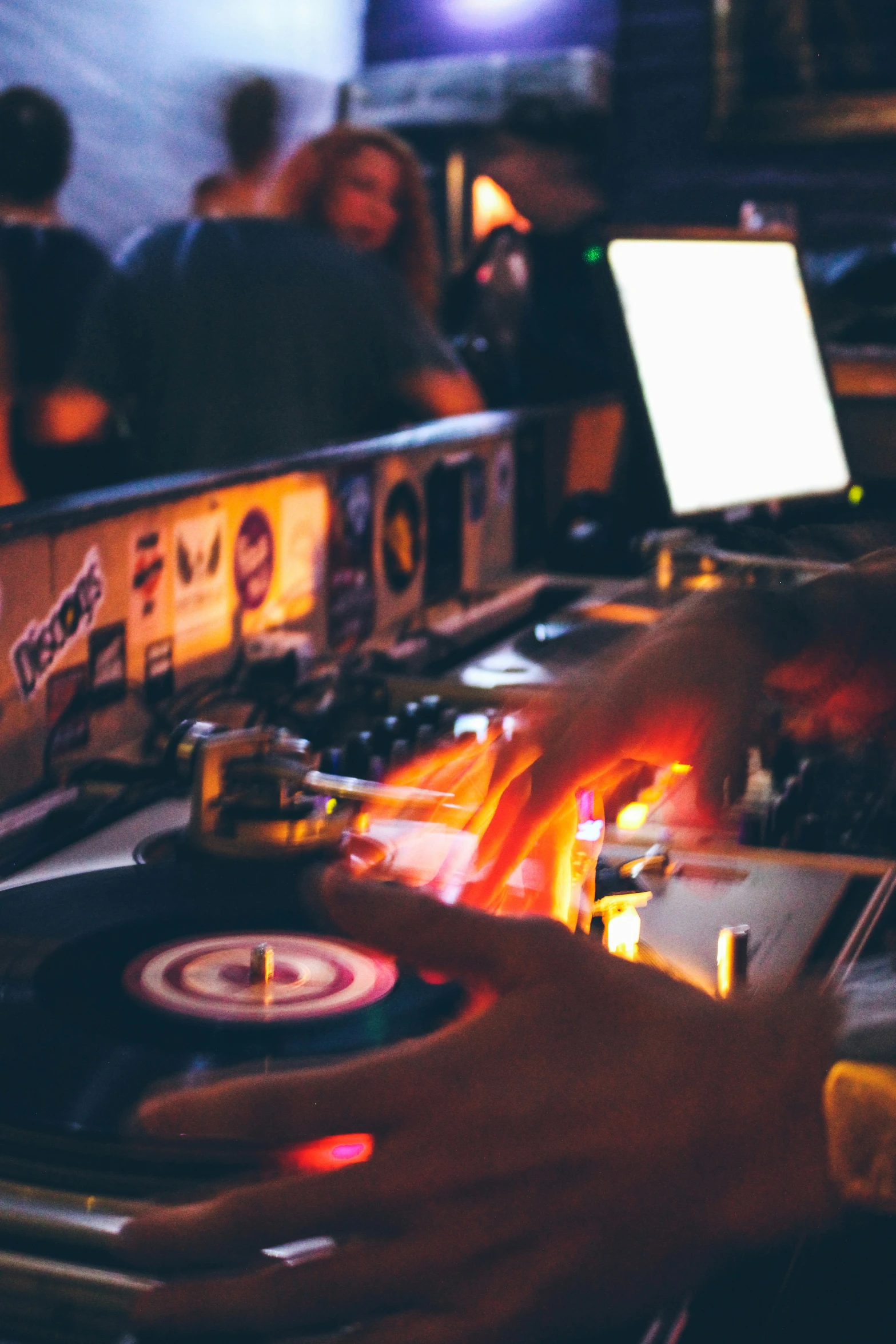 dj mixing in a night club with djs