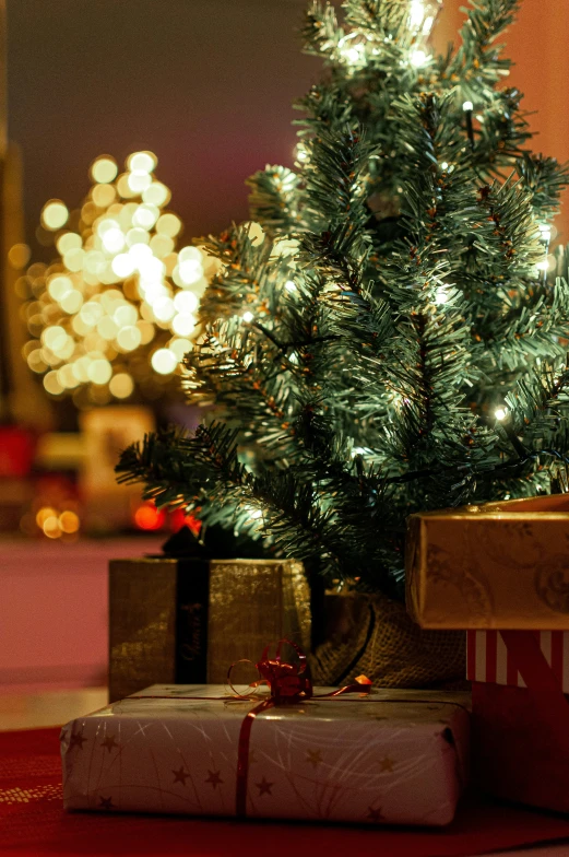 a christmas tree is covered in ornaments and lights