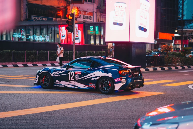 a sports car in the middle of a street