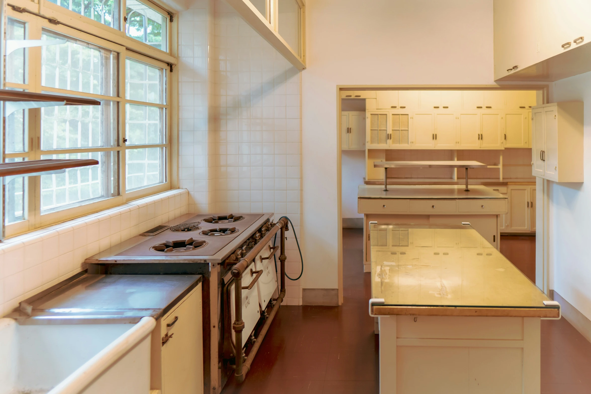 an old kitchen that has a lot of cabinets in it