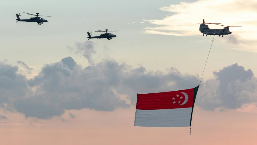 three planes flying side by side in the sky