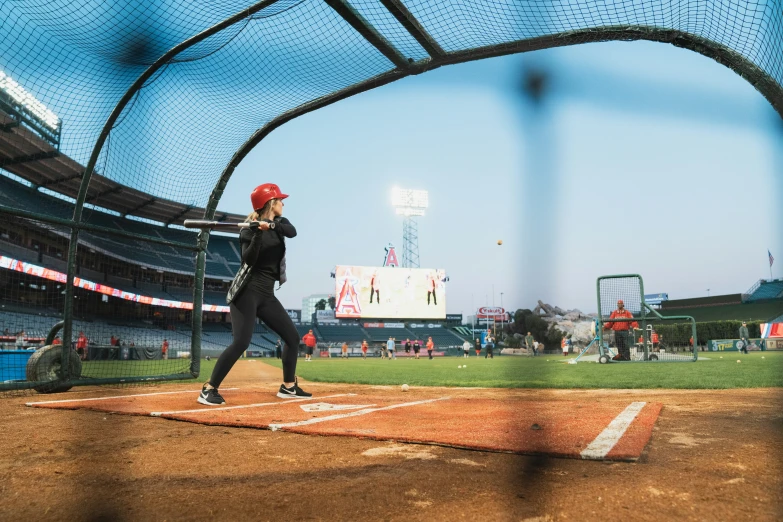 the baseball player prepares to hit the ball