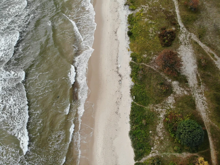 an aerial view of a beach and its surroundings
