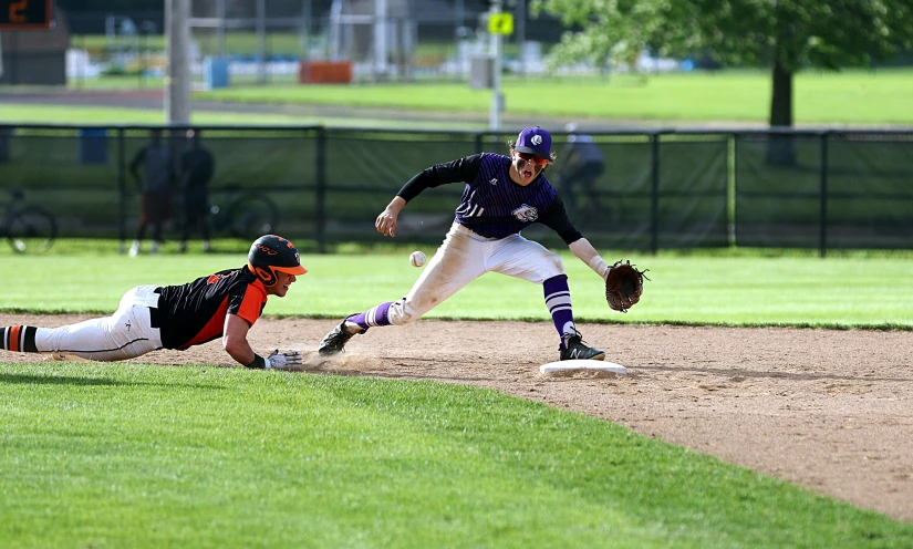 the baseball players are in action on the field