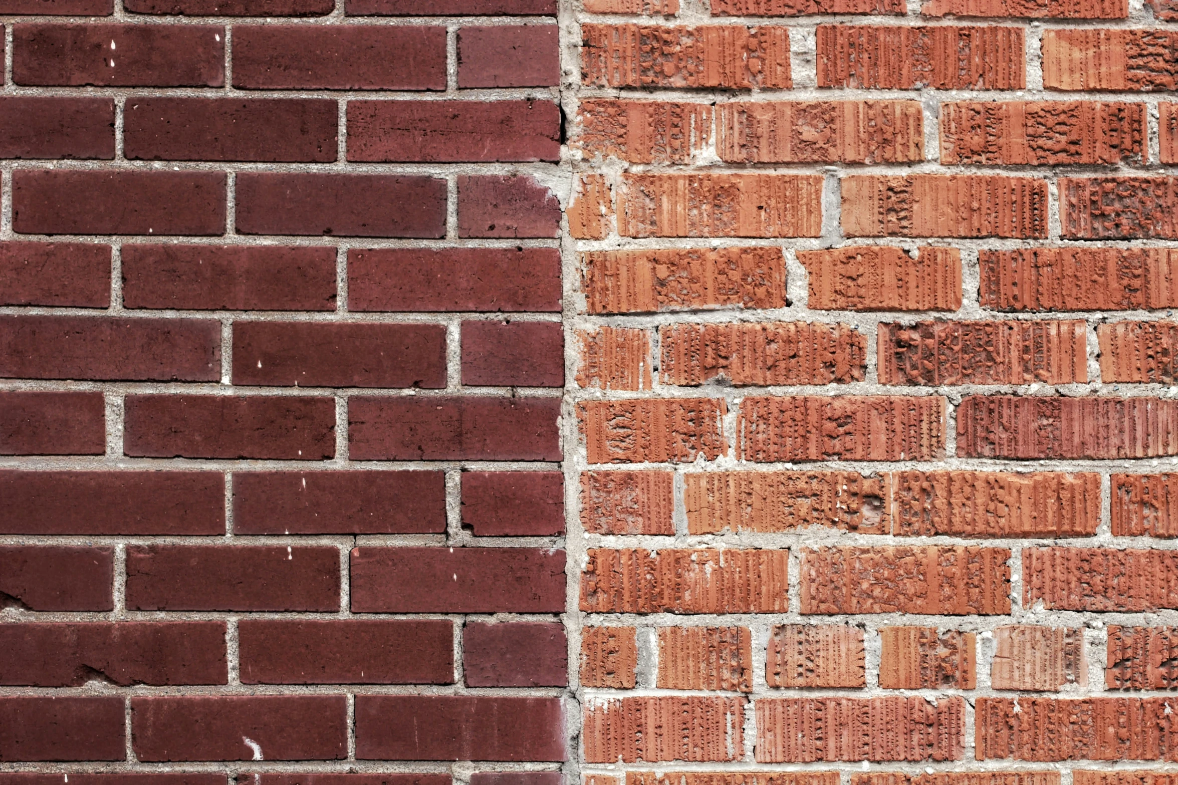 a brick wall has red and white bricks