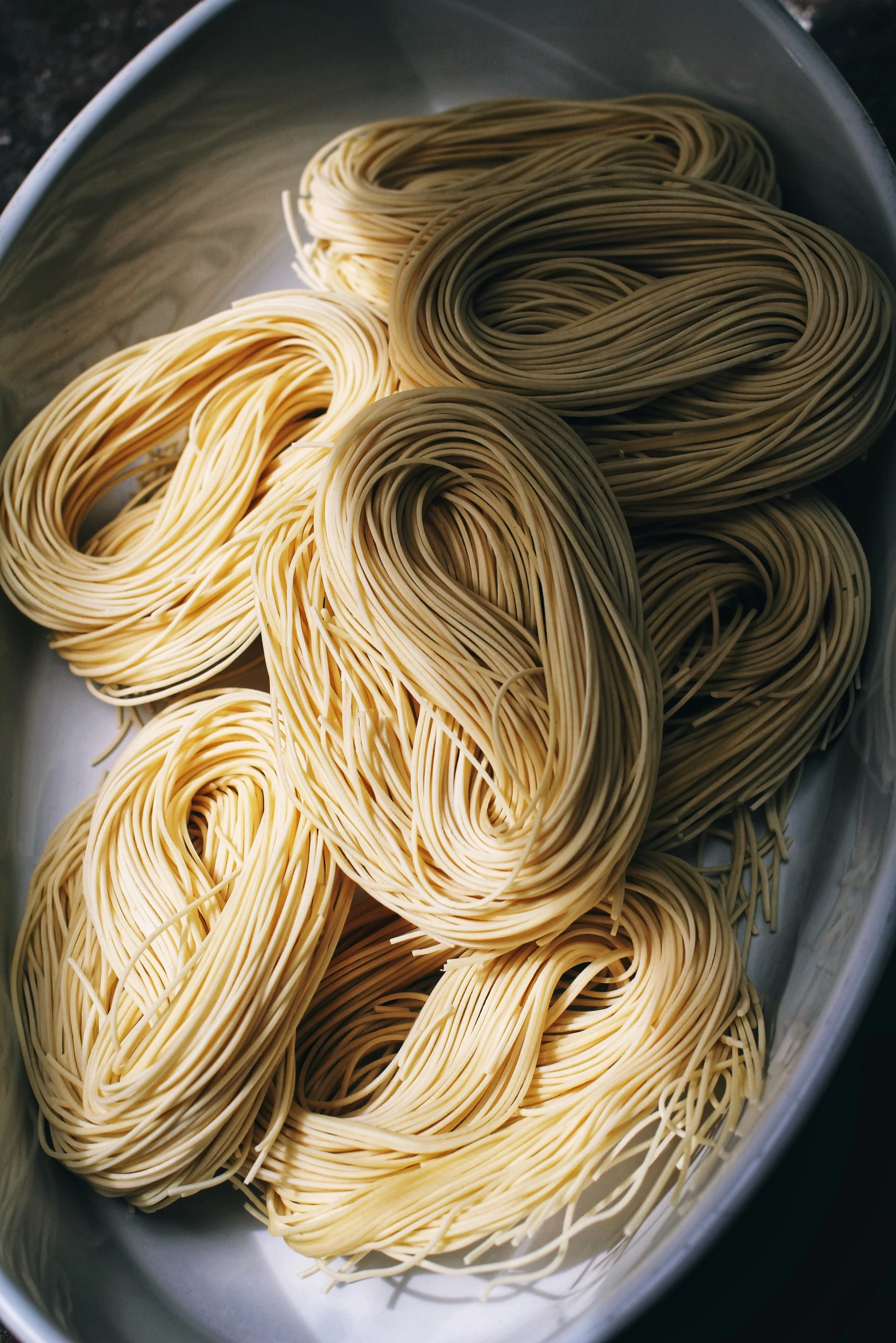 cooked pasta in a bowl on the ground