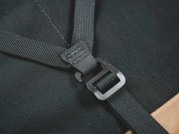 a buckle is on a jacket with its metal belt