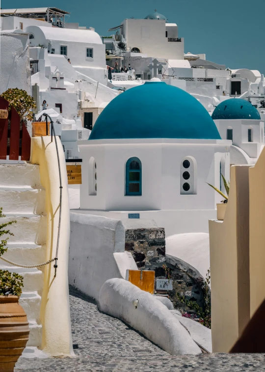 a white building with a blue dome on the top