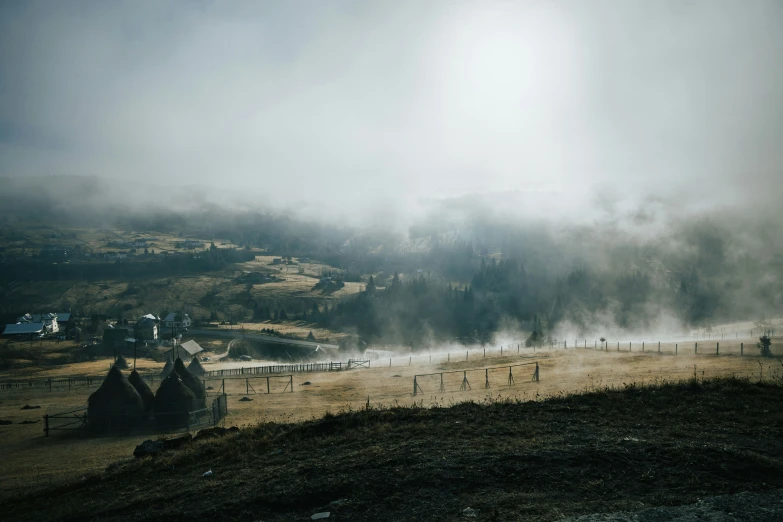 an image of fog and smoke rising up in the sky