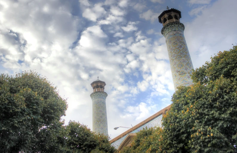 two towers are in the distance against the sky