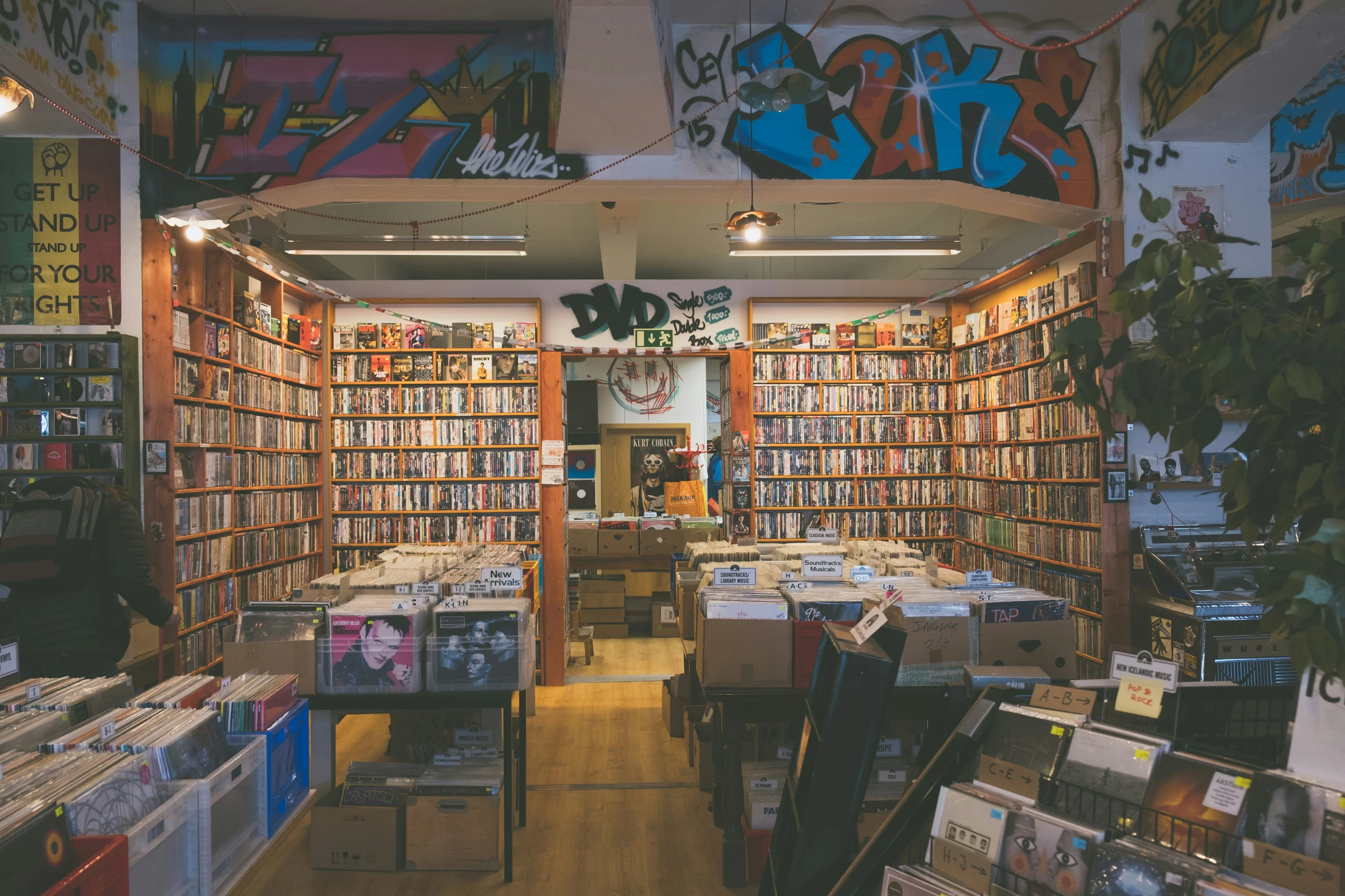 a book shop filled with lots of books on a display shelf