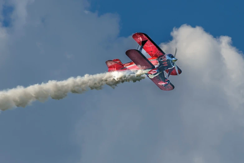 the two airplanes are flying side by side