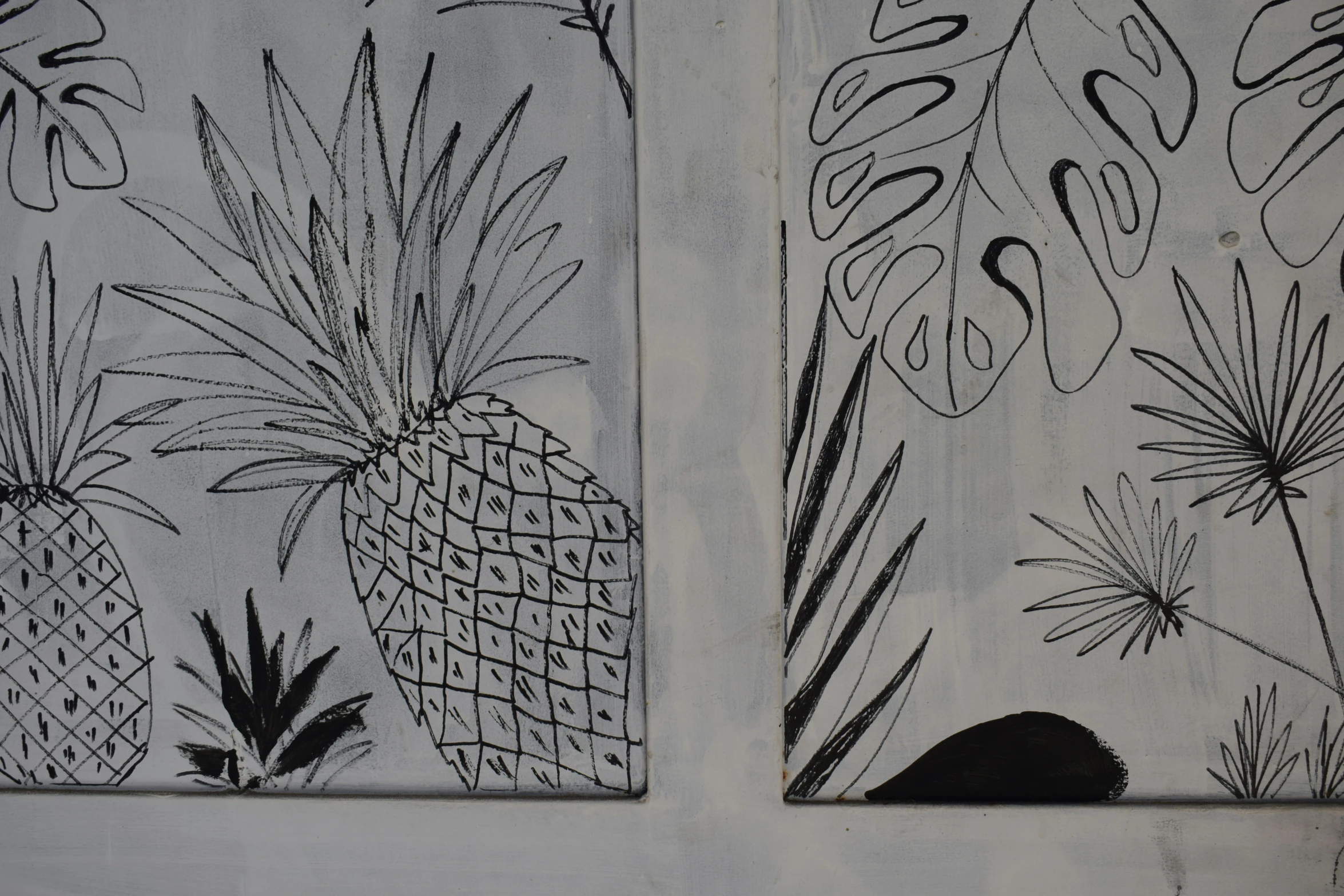 two small drawings of pineapples on white paper