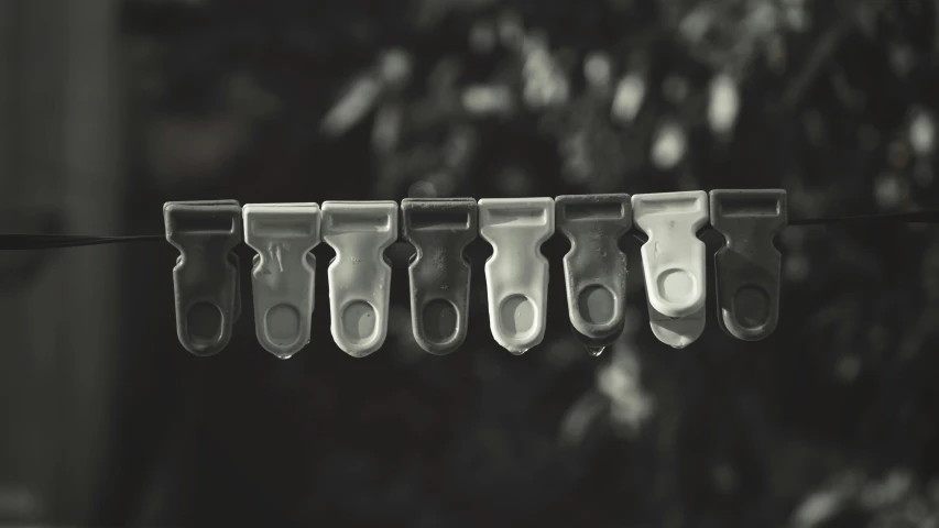 a group of scissors hanging out to dry