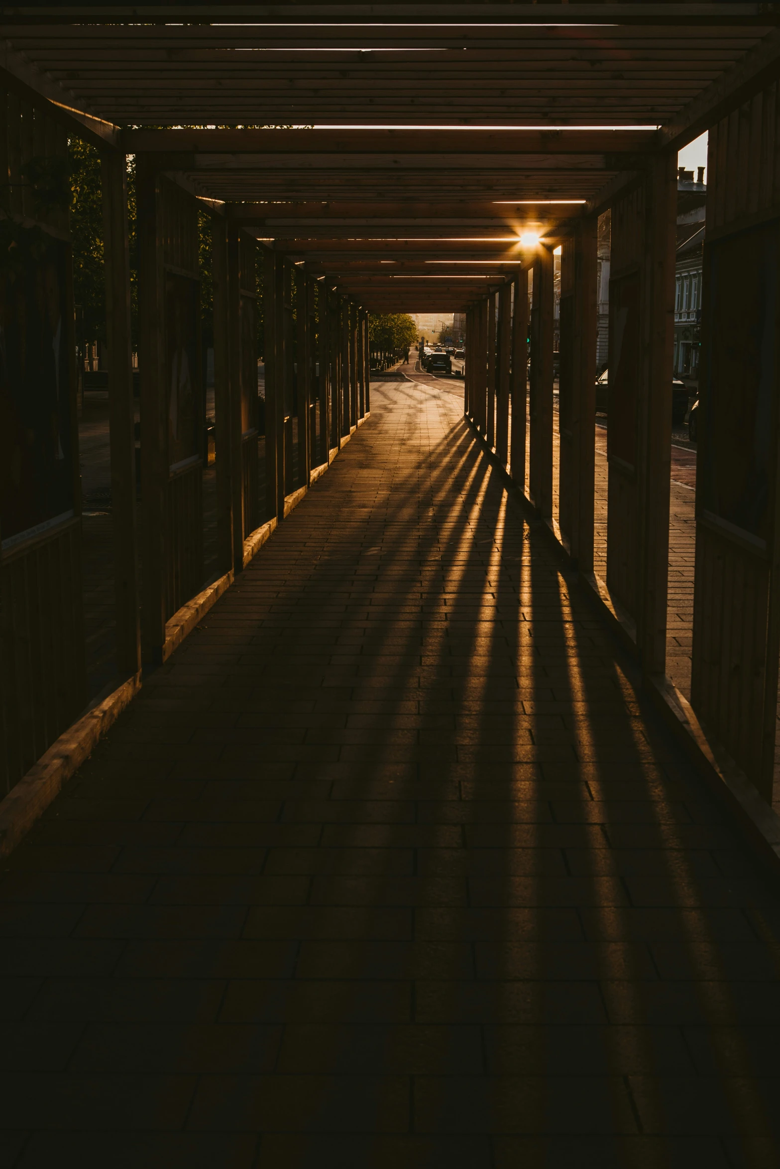 shadows in a walkway with some light coming in