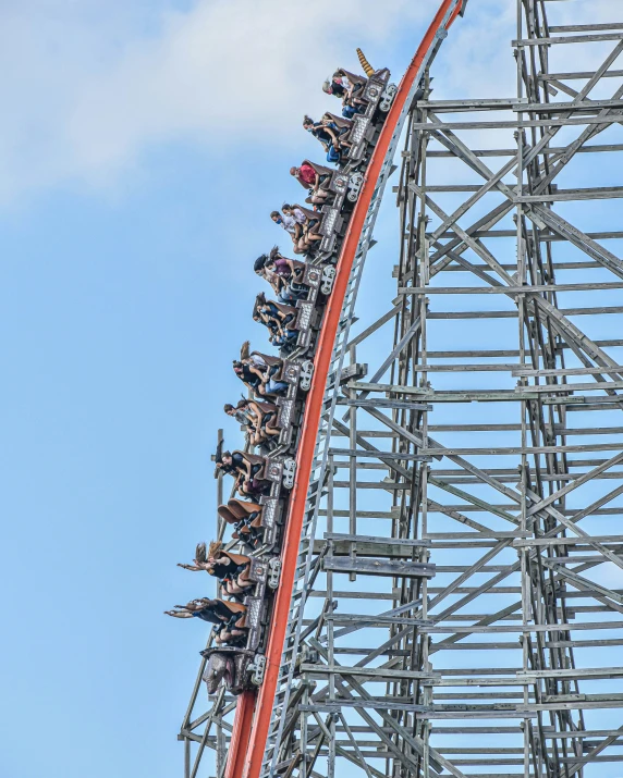 several people are in the middle of a roller coaster ride