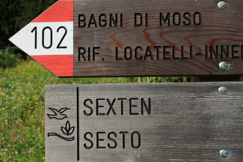 signs showing the route and location of different towns