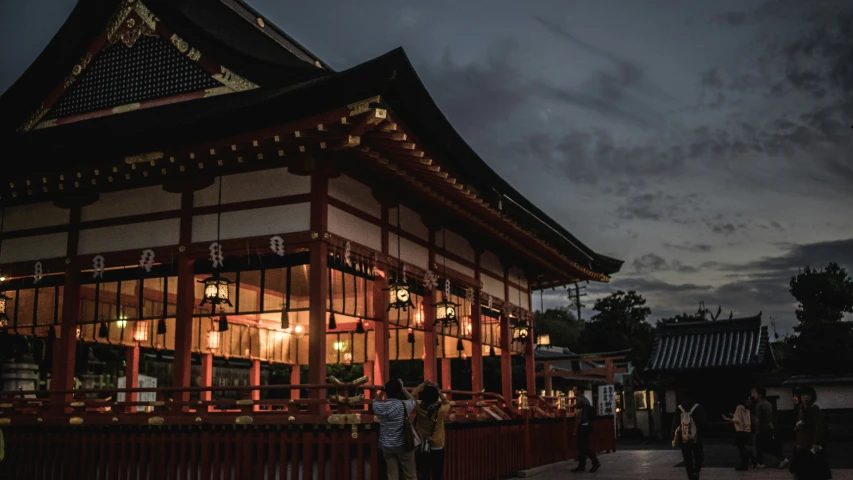 a traditional asian building with people looking on