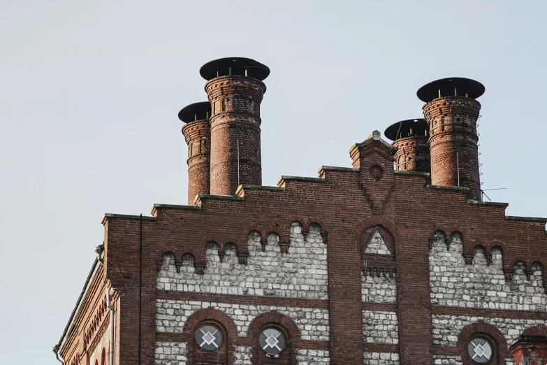 two chimneys on the roof of a building