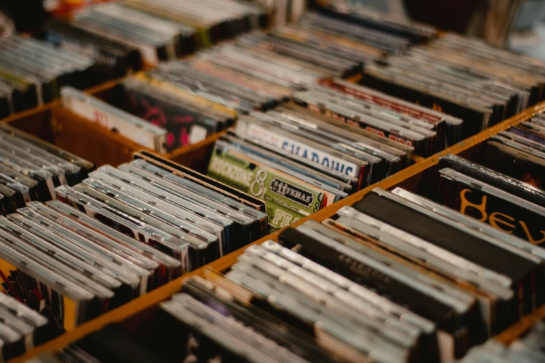 several stacks of cds in various colors, sizes and sizes