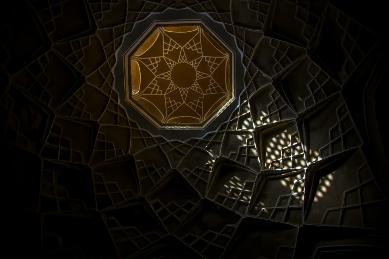 an artistic pograph of dark geometric shapes with an intricate design