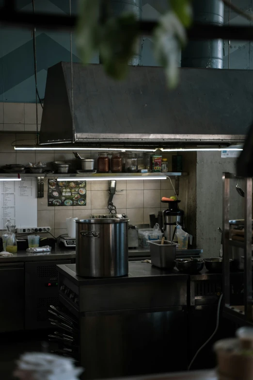 a large kitchen with multiple pots and pans