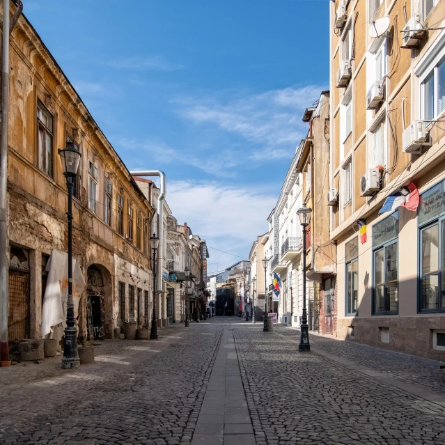 a narrow cobbled street with old buildings